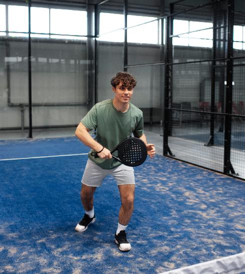 person-getting-ready-play-paddle-tennis-inside